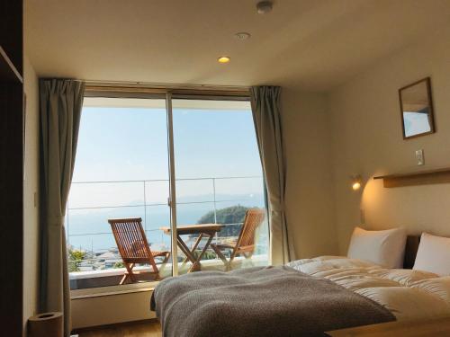 Krevet ili kreveti u jedinici u objektu MY LODGE Naoshima