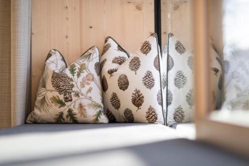 a group of pillows sitting on a window sill at Hotel Tann in Collalbo