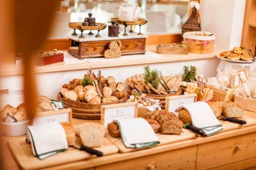 a display of bread and pastries in a bakery at Hotel Tann in Collalbo