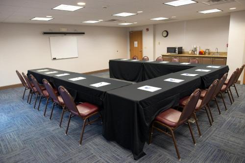 a conference room with a long table and chairs at Holiday Inn Express Hotel & Suites Chanhassen by IHG in Chanhassen