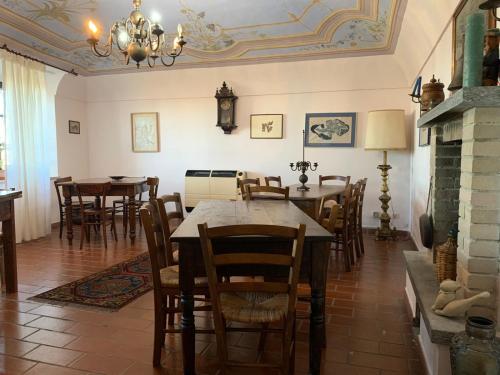 a dining room with a table and chairs at Cascina Alberta in Vignale