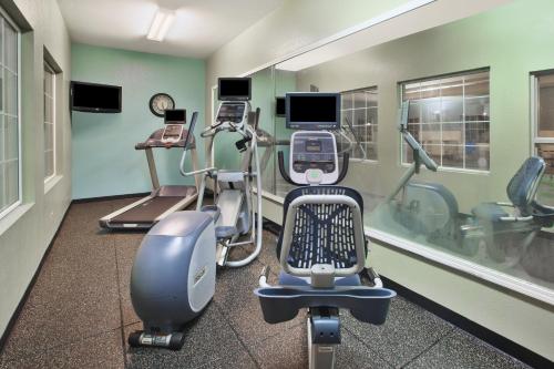 a gym with several exercise equipment in a room at Holiday Inn Express Hotel & Suites Manchester Conference Center by IHG in Manchester