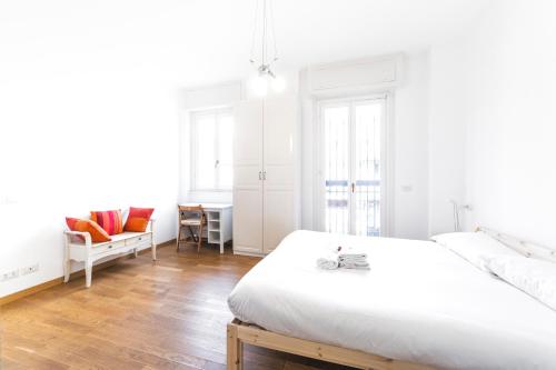Posteľ alebo postele v izbe v ubytovaní Loreto Elegant Flat