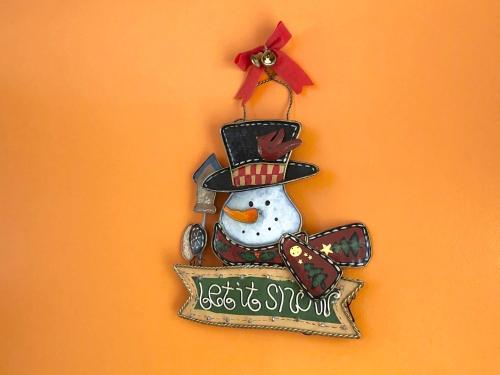 a christmas ornament of a snowman on a wall at Hotel Resort Inn Niseko in Niseko