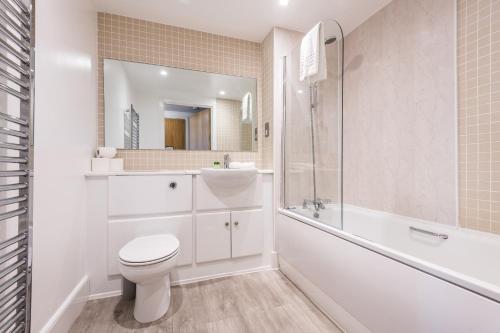 a bathroom with a toilet and a shower and a sink at Host & Stay - Standish Street Place in Liverpool