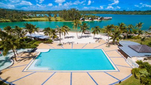 an aerial view of a resort with a swimming pool at Holiday Inn Resort Vanuatu by IHG in Port Vila