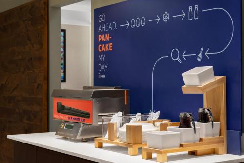 a store counter with a cash register and other products at Holiday Inn Express Hotel & Suites McAlester, an IHG Hotel in McAlester