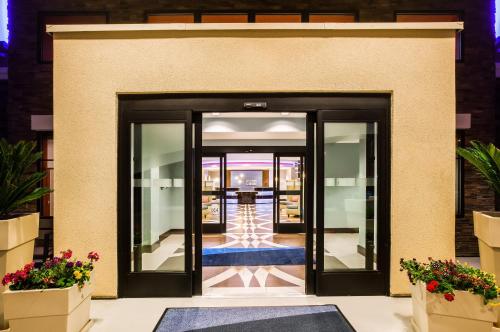 an entrance to a building with black doors at Holiday Inn Express & Suites Eureka by IHG in Eureka