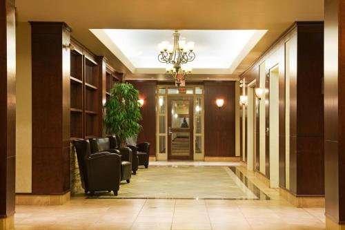 a conference room with chairs and a chandelier at Holiday Inn & Suites Lloydminster by IHG in Lloydminster