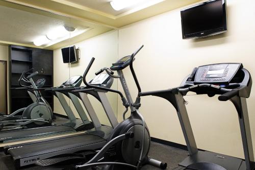 a room with three exercise bikes and a cell phone at Holiday Inn & Suites Lloydminster by IHG in Lloydminster