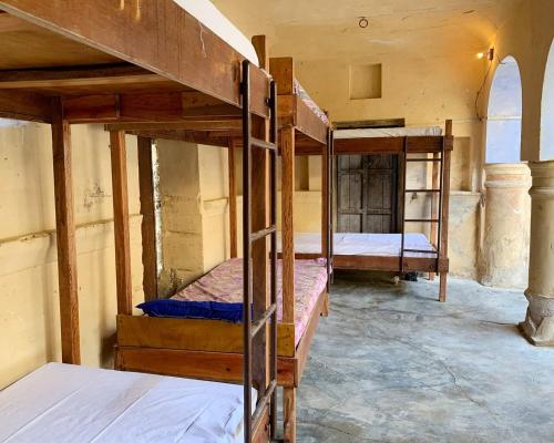Ένα ή περισσότερα κρεβάτια σε δωμάτιο στο topaz backpackers