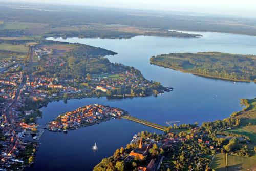 an island in the middle of a lake at Ferienhaus Ursula in Malchow