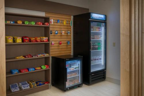 a refrigerator with its door open in a room at Holiday Inn Express Lawrence by IHG in Lawrence