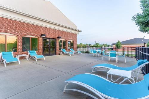 a group of chairs sitting outside of a building at Holiday Inn Express & Suites O'Fallon-Shiloh by IHG in Shiloh