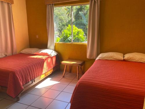 Кровать или кровати в номере Ranchito Camping