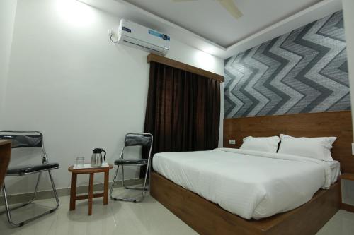Ένα ή περισσότερα κρεβάτια σε δωμάτιο στο Hotel BG Inn