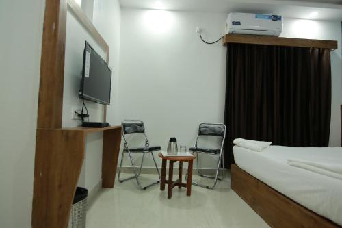 Μια τηλεόραση ή/και κέντρο ψυχαγωγίας στο Hotel BG Inn