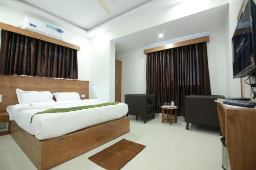 Кровать или кровати в номере Hotel BG Inn