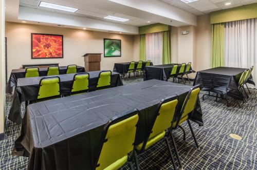 a conference room with a table and chairs and a podium at Holiday Inn Express Hotel & Suites Vinita by IHG in Vinita