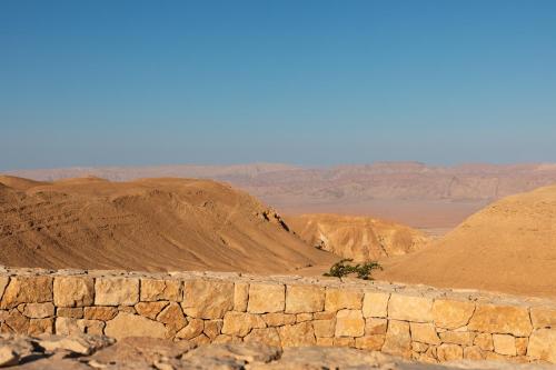 a view of the desert with mountains in the background at Six Senses Shaharut in Shaharut