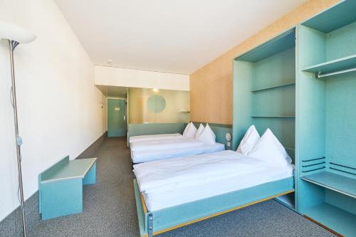 Postel nebo postele na pokoji v ubytování Hotel City am Bahnhof