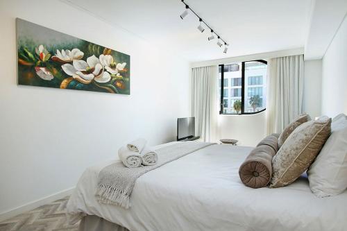 Ένα ή περισσότερα κρεβάτια σε δωμάτιο στο Tuynhuys Self Catering Studio Apartments