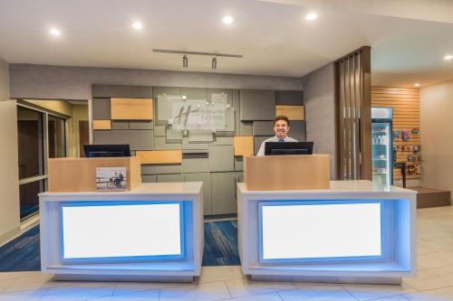 a man sitting at a desk in an office at Holiday Inn Express & Suites Lake Havasu - London Bridge by IHG in Lake Havasu City