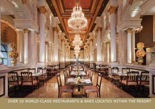 a dining room filled with tables and chairs at Jumeirah Zabeel Saray in Dubai