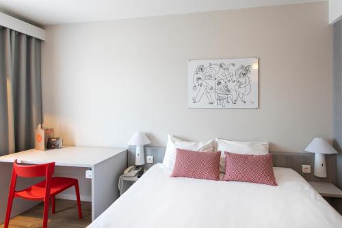 Ein Bett oder Betten in einem Zimmer der Unterkunft Ibis Valencia Alfafar