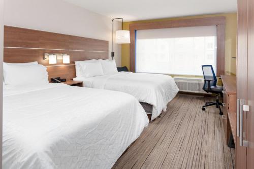 a hotel room with two beds and a window at Holiday Inn Express & Suites - Gilbert - East Mesa by IHG in Gilbert