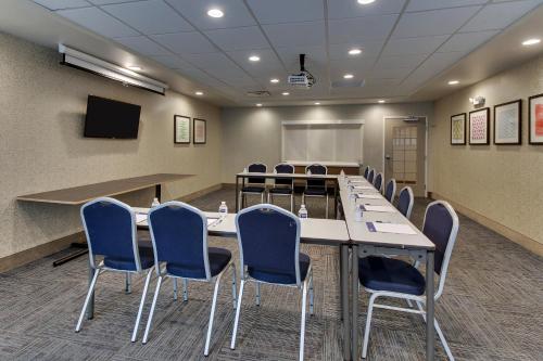 a conference room with a long table and chairs at Holiday Inn Express & Suites Ithaca by IHG in Ithaca