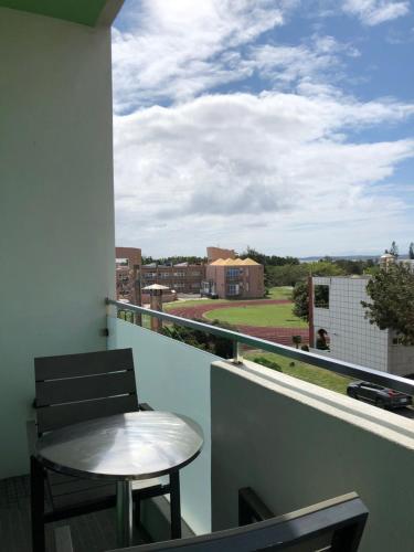 Un balcón o terraza de Bai Sha Tan Cottage