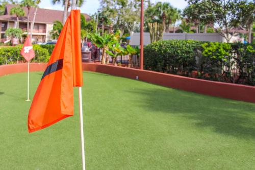an orange flag on top of a field of grass at Hilton Vacation Club Polynesian Isles Kissimmee in Kissimmee