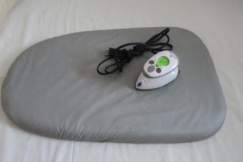 a cake with a remote control on top of a table at WEST WOOD GUEST ROOM in Osaka