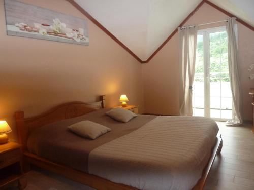 Katil atau katil-katil dalam bilik di Chambres d'hôtes DORIS
