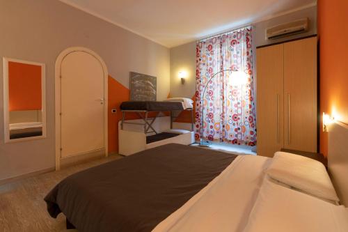 Postel nebo postele na pokoji v ubytování H Rooms boutique Hotel