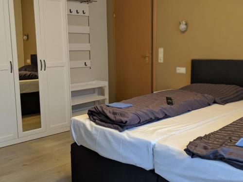 מיטה או מיטות בחדר ב-Asiatisches Landhaus