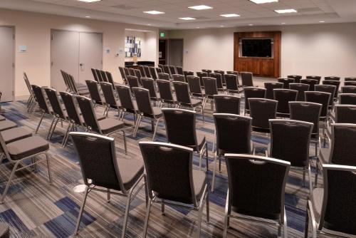 a room with rows of chairs in a classroom at Holiday Inn Express Hotels & Suites Loma Linda by IHG in Loma Linda