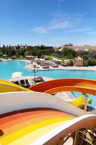 a view of a swimming pool with a resort at Kenzi Club Agdal Medina - All Inclusive in Marrakesh