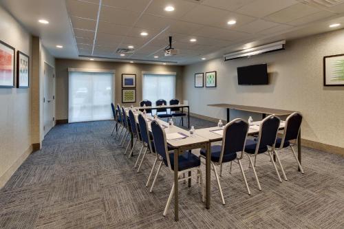 a conference room with a long table and chairs at Holiday Inn Express & Suites Ithaca by IHG in Ithaca