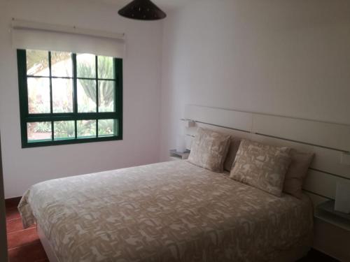 Säng eller sängar i ett rum på Paradiso Canario Playa Blanca