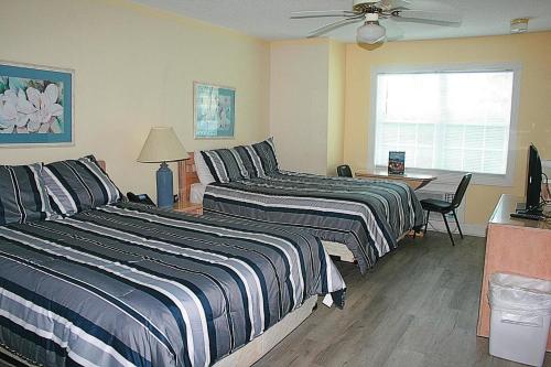 Voodi või voodid majutusasutuse 27 Holes of Golf Surrounds the Home 101L toas