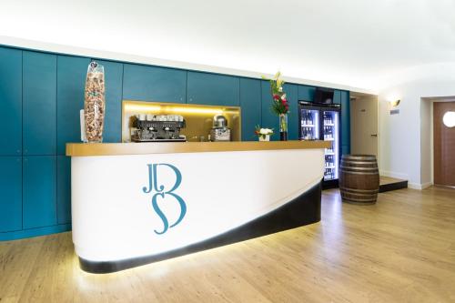 a bar with the letter b on it in a room at Hôtel Le Bellevue in Les Roches-de-Condrieu