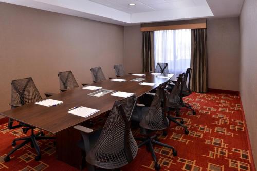 a conference room with a long table and chairs at Holiday Inn Express & Suites Page - Lake Powell Area by IHG in Page