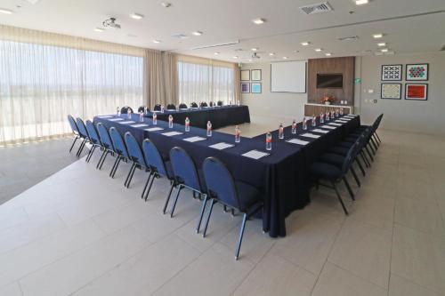 a large conference room with a long table and chairs at Holiday Inn Express & Suites - Playa del Carmen by IHG in Playa del Carmen