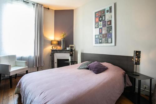 Ένα ή περισσότερα κρεβάτια σε δωμάτιο στο Maison de ville