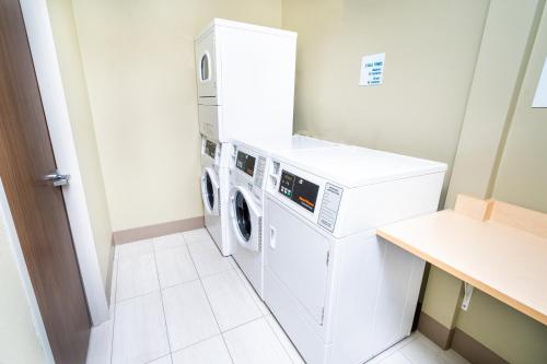 a laundry room with a washer and dryer at Holiday Inn Express & Suites Las Vegas SW Springvalley, an IHG Hotel in Las Vegas