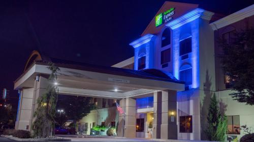 a hotel with blue lights on the front of it at Holiday Inn Express Hotel & Suites Newton Sparta by IHG in Newton