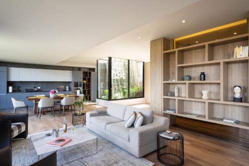 a living room with a couch and a table at Cassa Luxury Homes in Bogotá