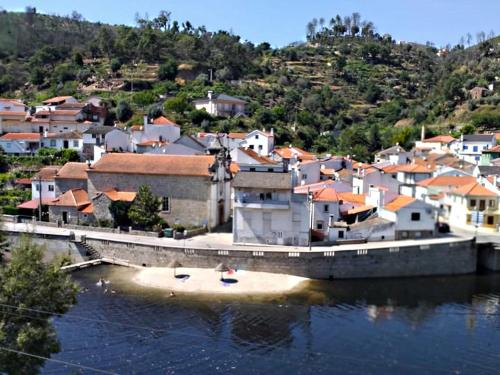 a small island in the middle of a body of water at Casa das Relvas in Penalva de Alva